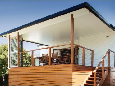A flat skillion insulated roof built on a timber deck with adjustable louvres.