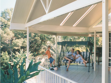 A gable insulated patio roof with light panels.